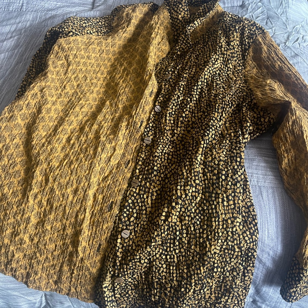 Button up shirt. New with tags. Runs small. Actually like an xl